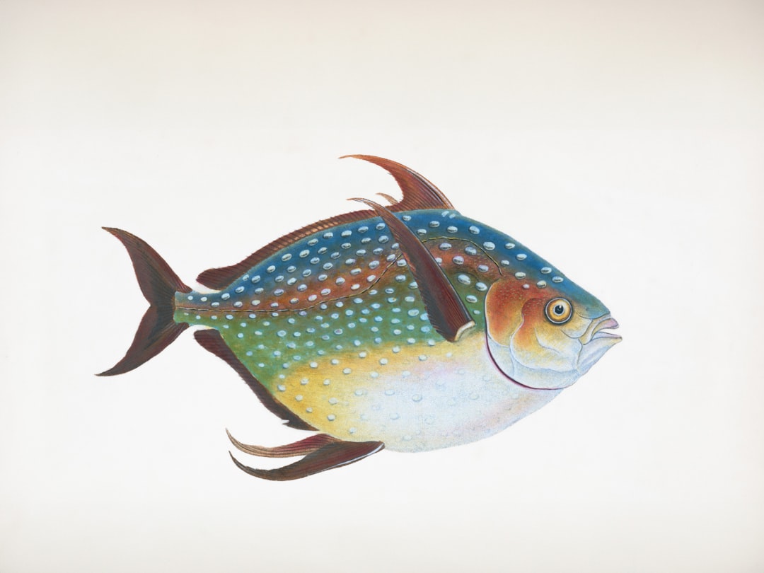 A colorful fish with blue spots and yellow belly.