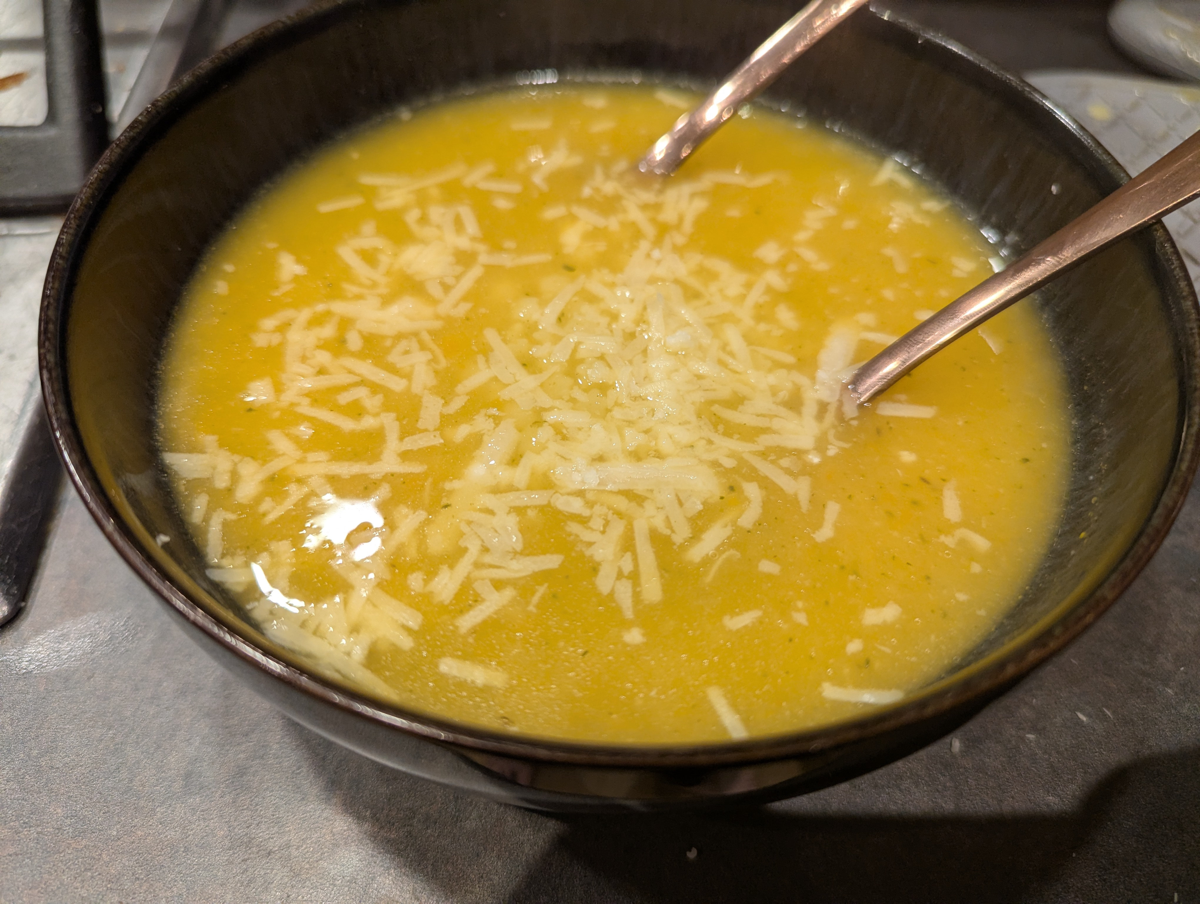 Pastina soup topped with parmesan