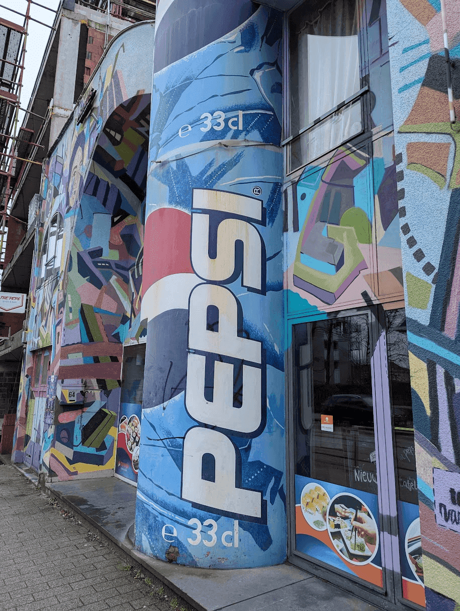 Cafe with a giant Pepsi can as its front awning